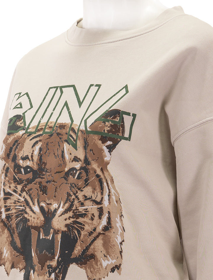 Close-up view of Anine Bing's tiger sweatshirt in stone.
