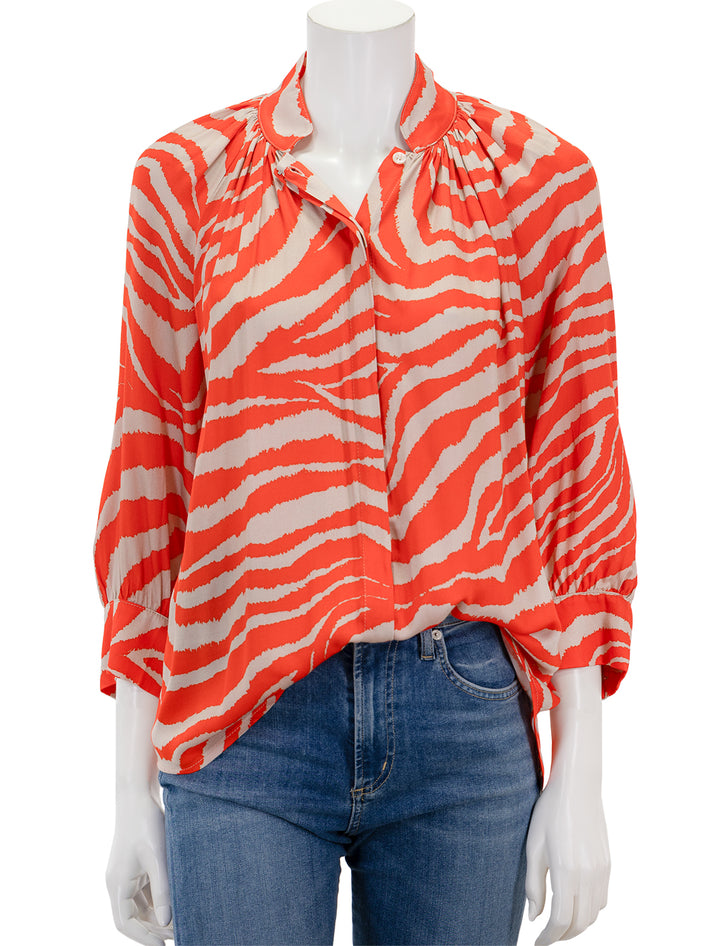 Front view of Smythe's gathered blouse in vermilion zebra.