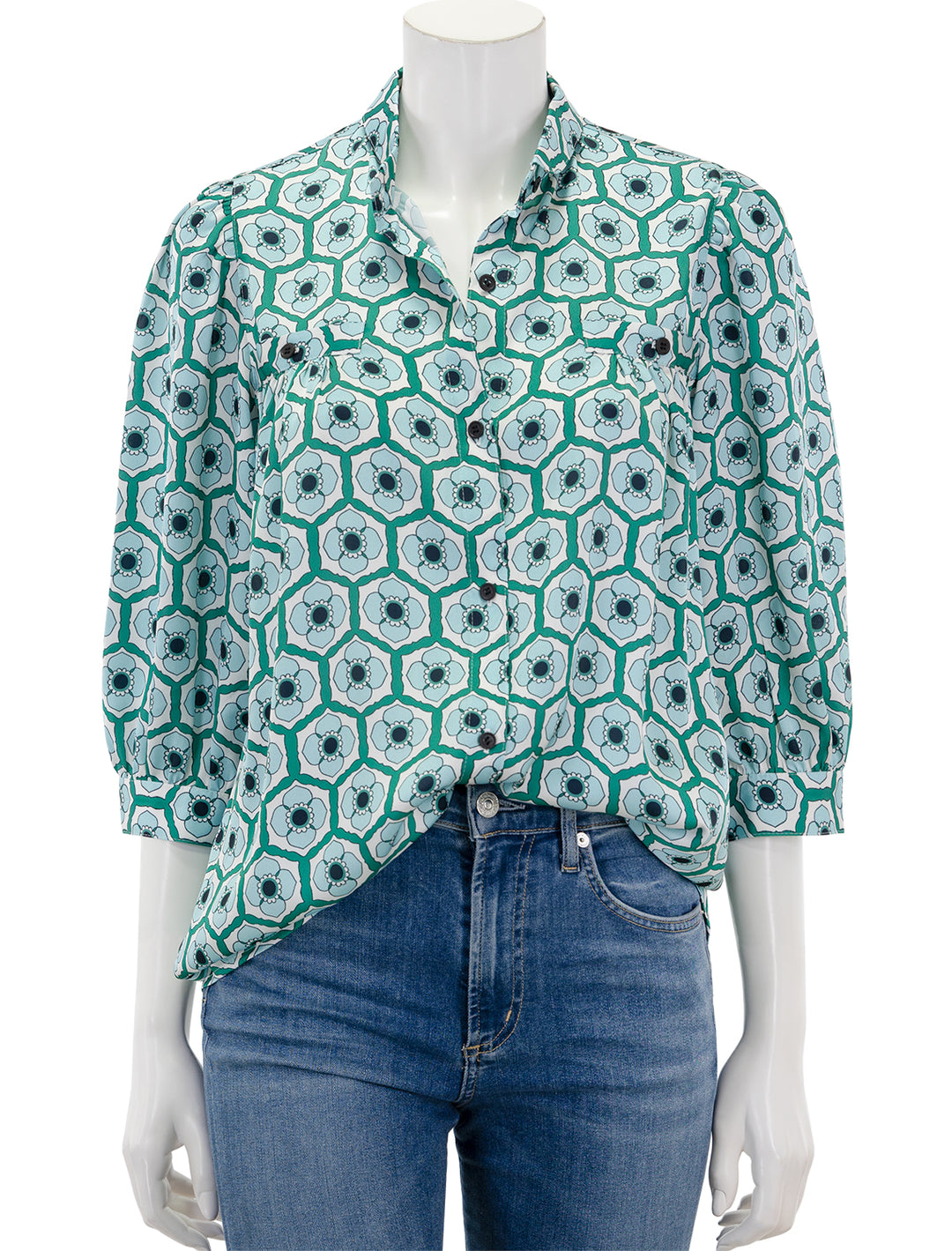 Front view of Smythe's shirred pocket blouse in blue green floral.