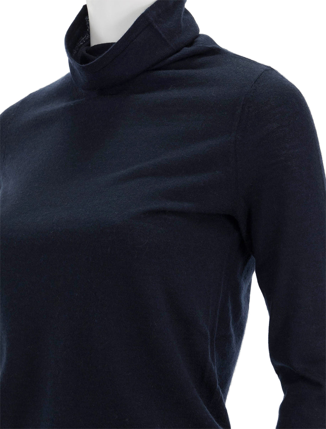 Close-up view of Ann Mashburn's funnel neck cashmere sweater in navy.