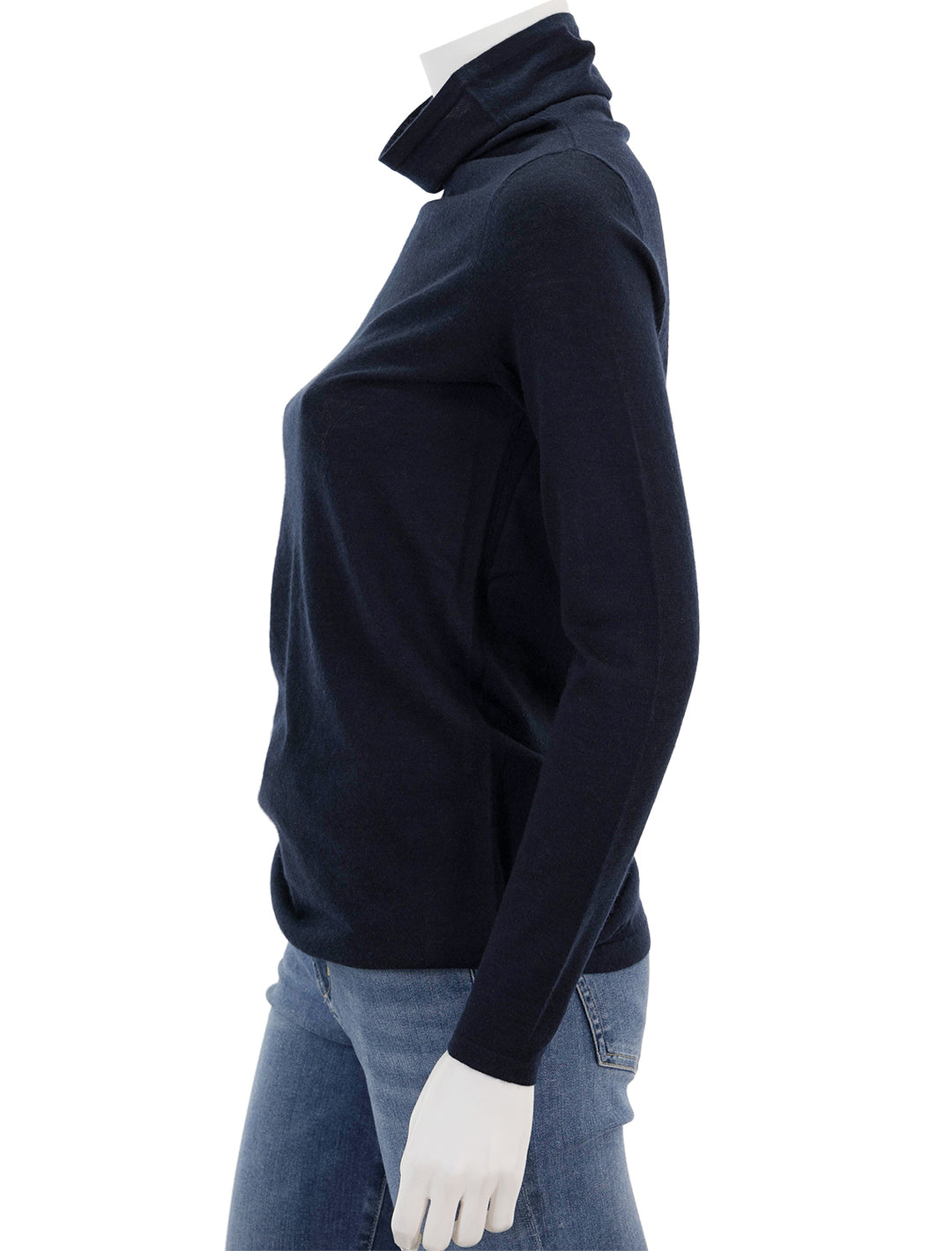 Side view of Ann Mashburn's funnel neck cashmere sweater in navy.