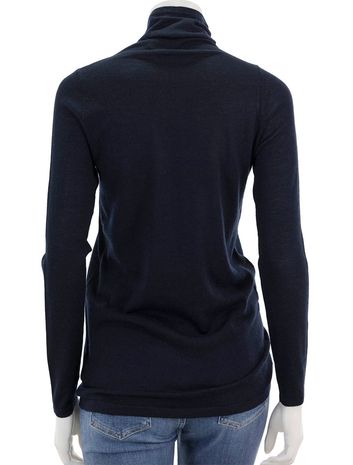 Back view of Ann Mashburn's funnel neck cashmere sweater in navy.