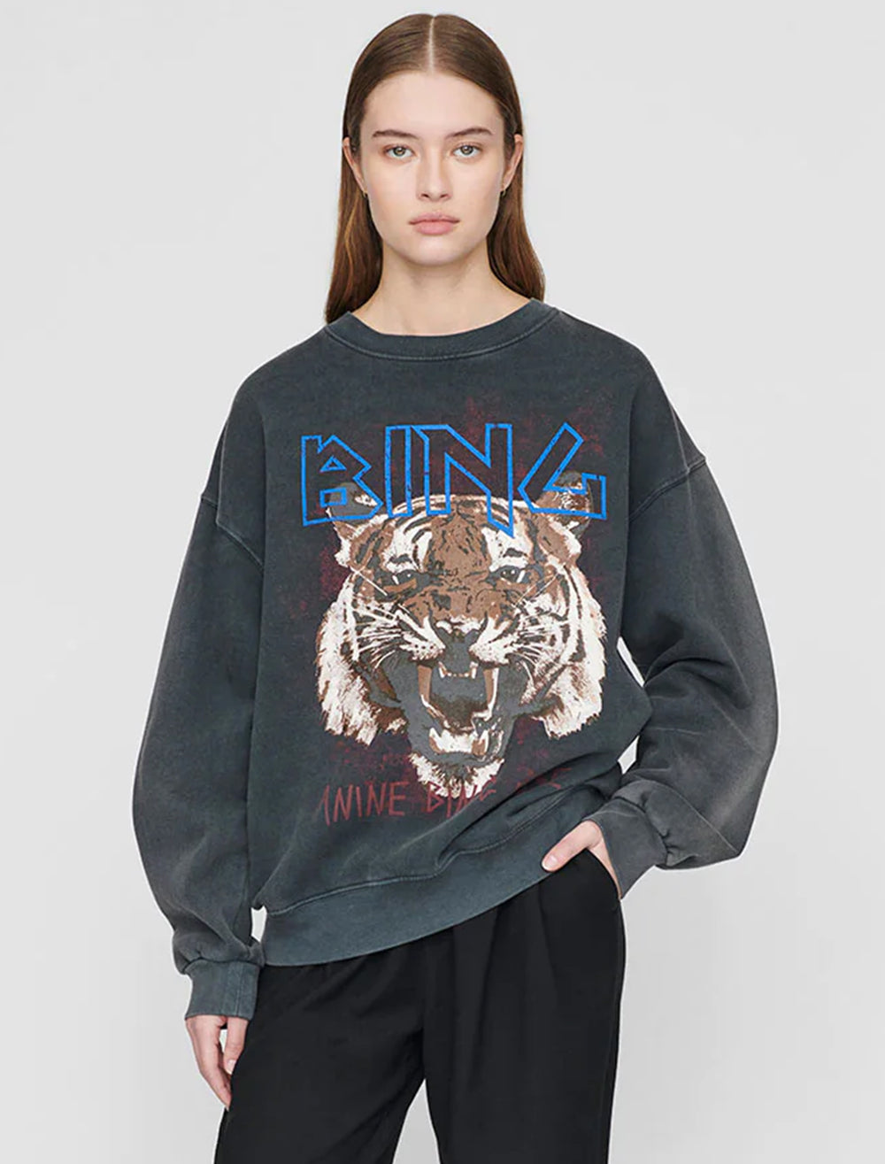 Model wearing Anine Bing's tiger sweatshirt in black.