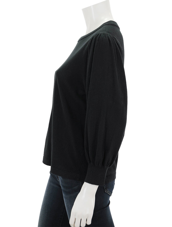 Side view of Lilla P.'s rib trim puff sleeve sweater in black.