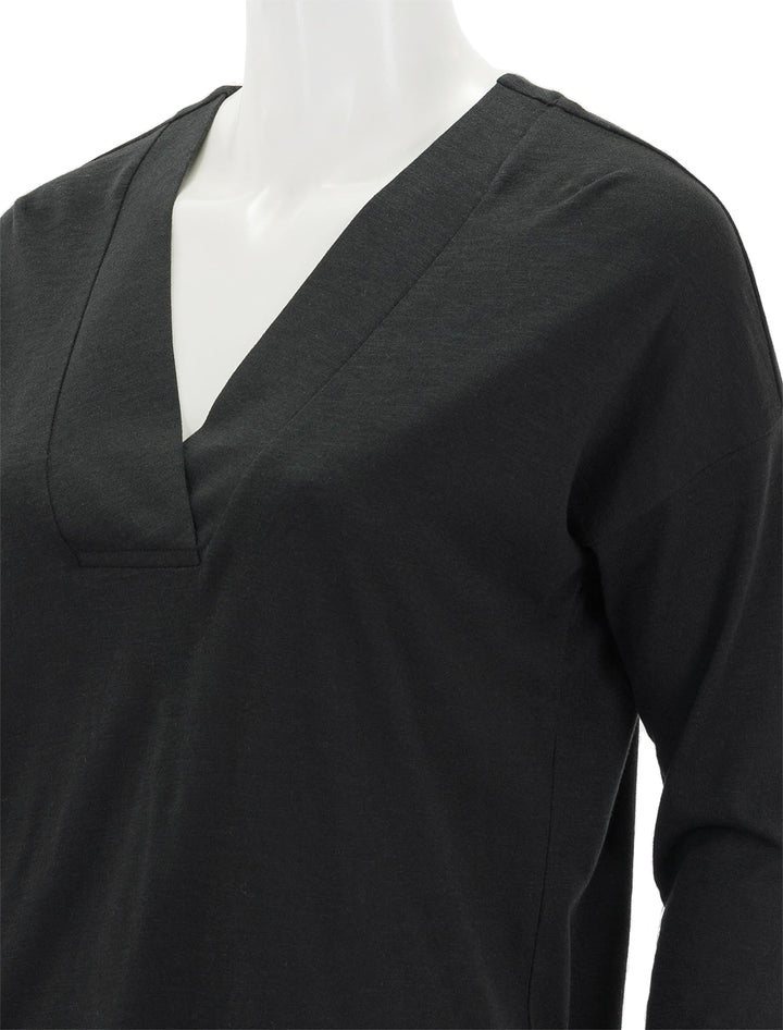 Close-up view of Lilla P.'s tapered trim v-neck in black.