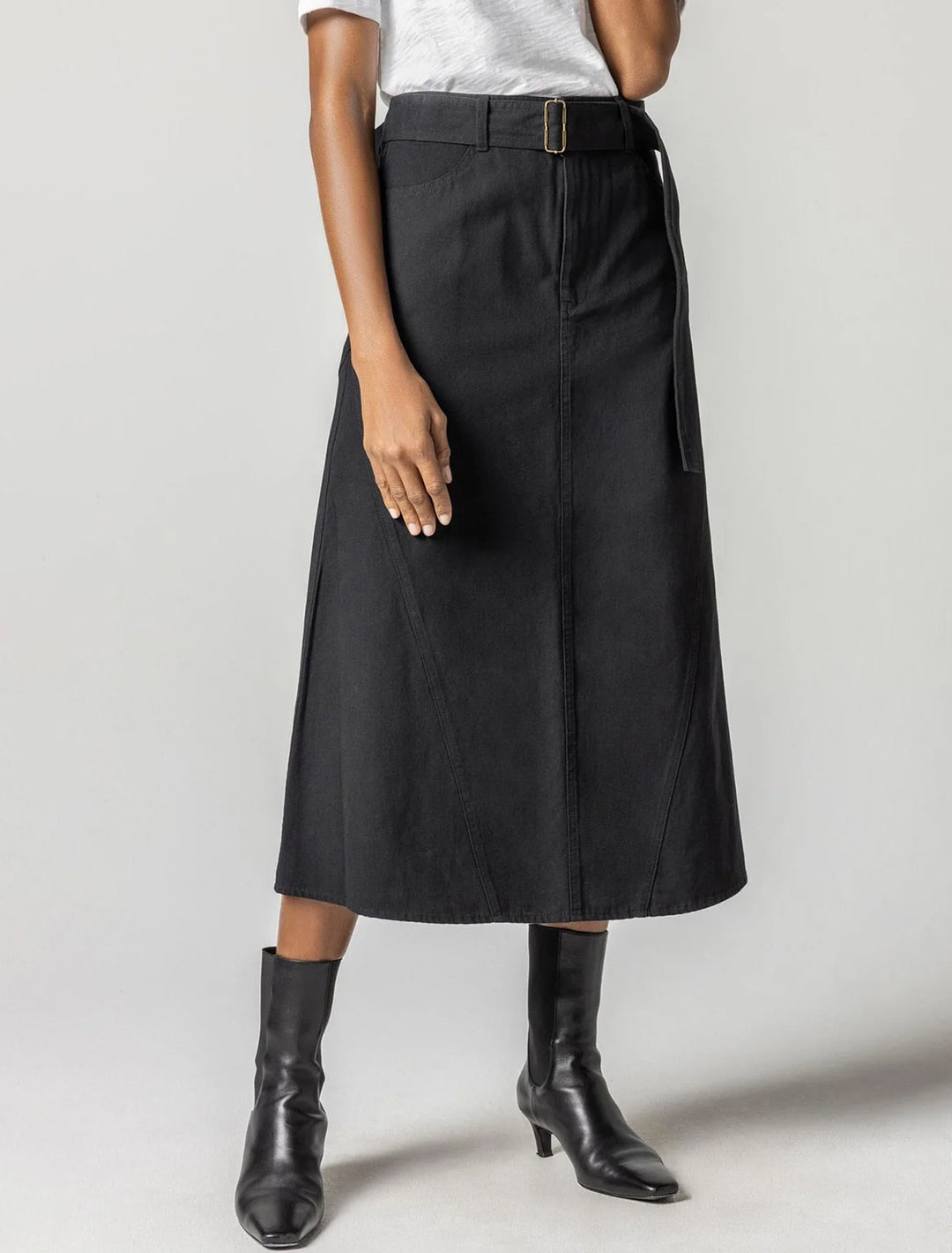 Model wearing Lilla P.'s jean skirt in black.
