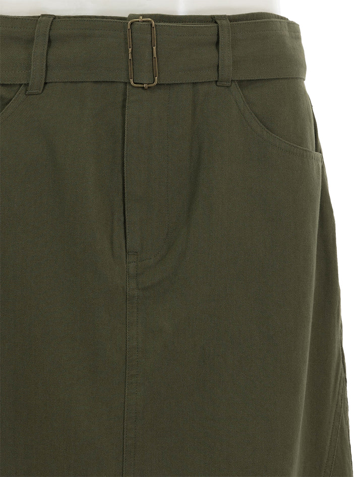 Close-up view of Lilla P.'s jean skirt in army.