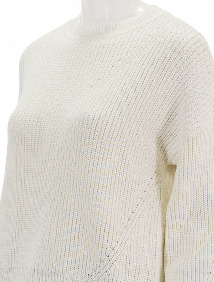 Close-up view of Lilla P.'s oversized rib pullover sweater in ivory.