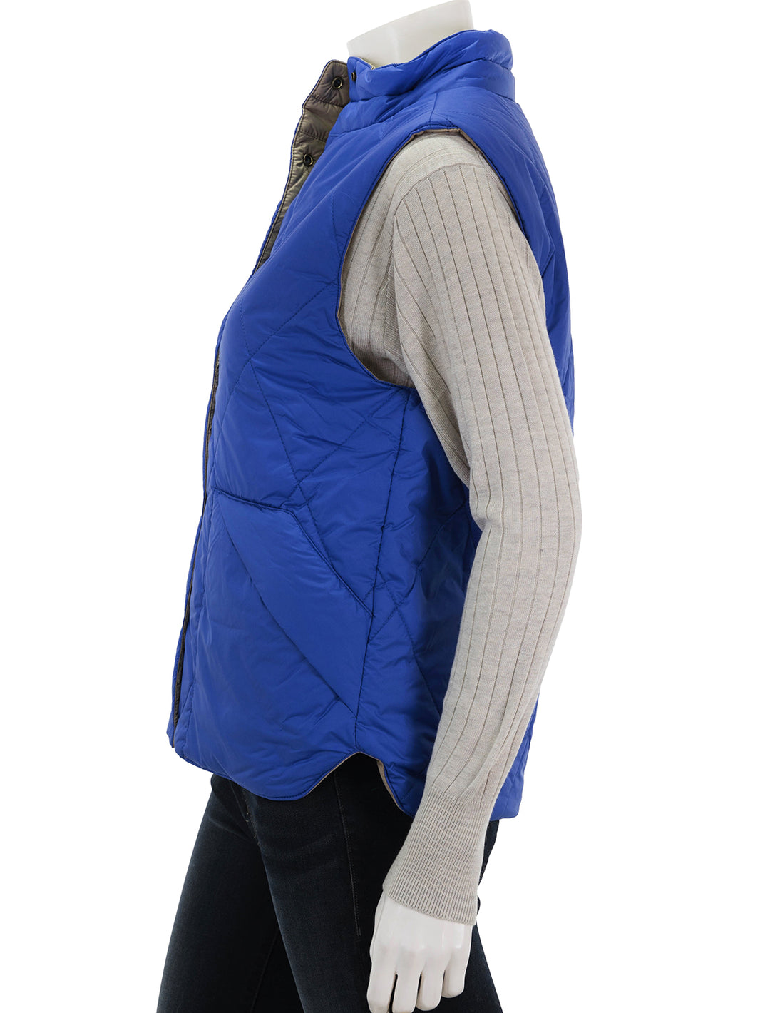 Side view of Lilla P.'s reversible snap front vest in sapphire.