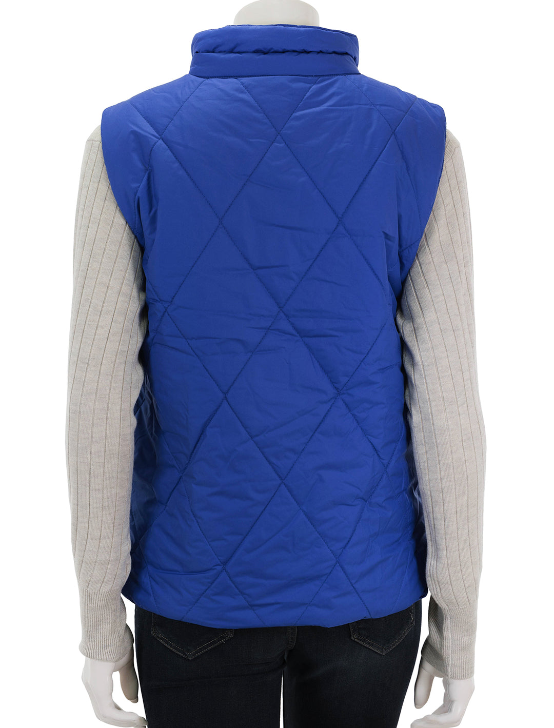 Back view of Lilla P.'s reversible snap front vest in sapphire.