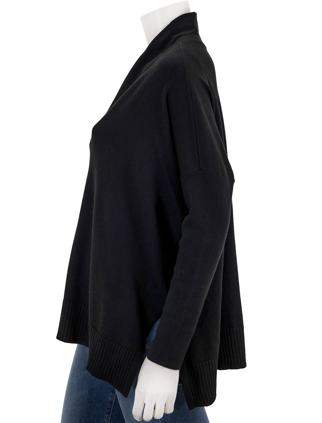 Side view of Lilla P.'s oversized shawl collar sweater in black.