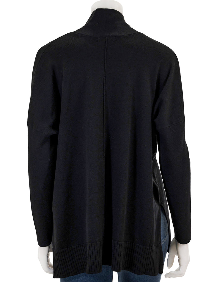 Back view of Lilla P.'s oversized shawl collar sweater in black.