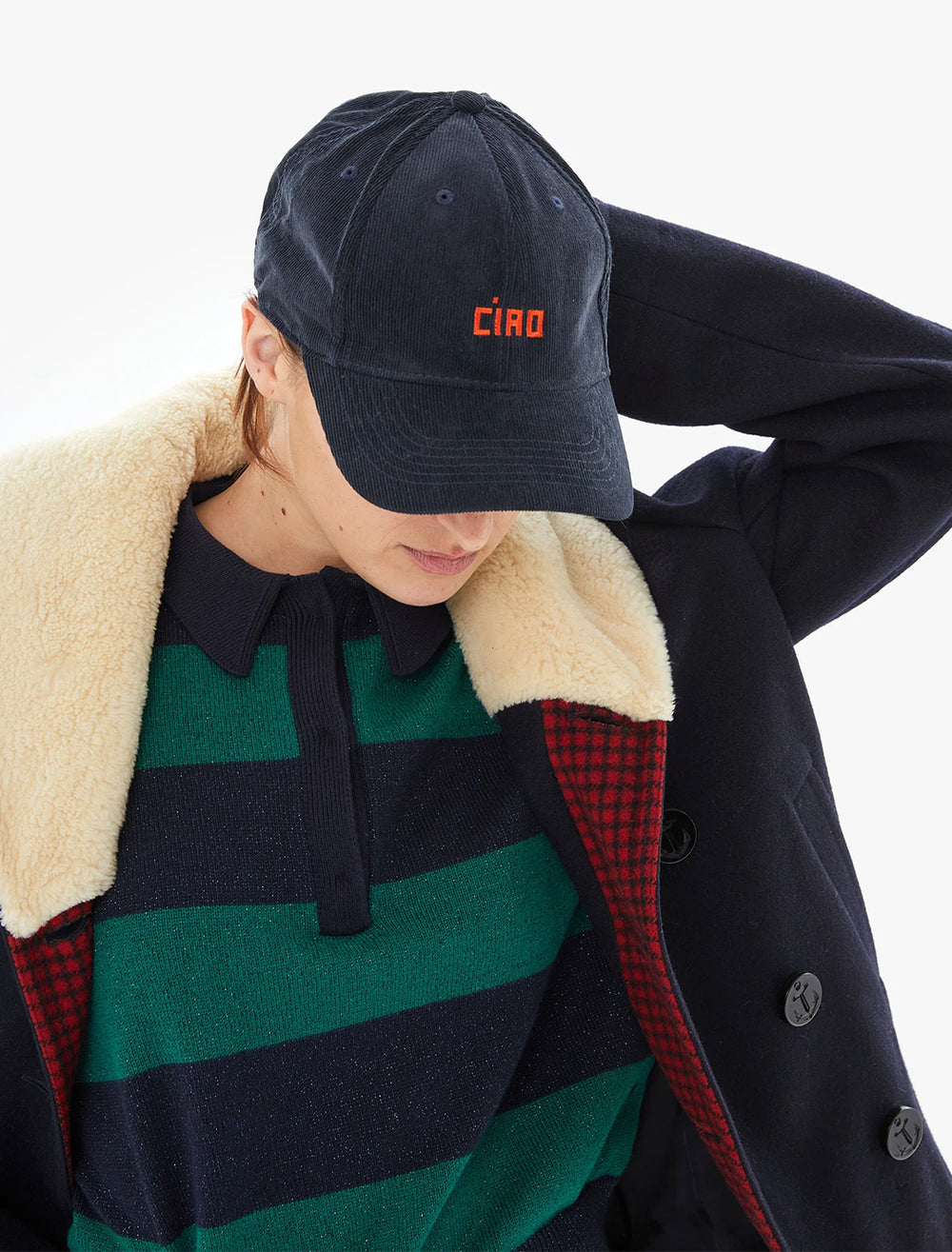 Model wearing Clare V.'s Ciao Baseball Hat in Navy Corduroy.