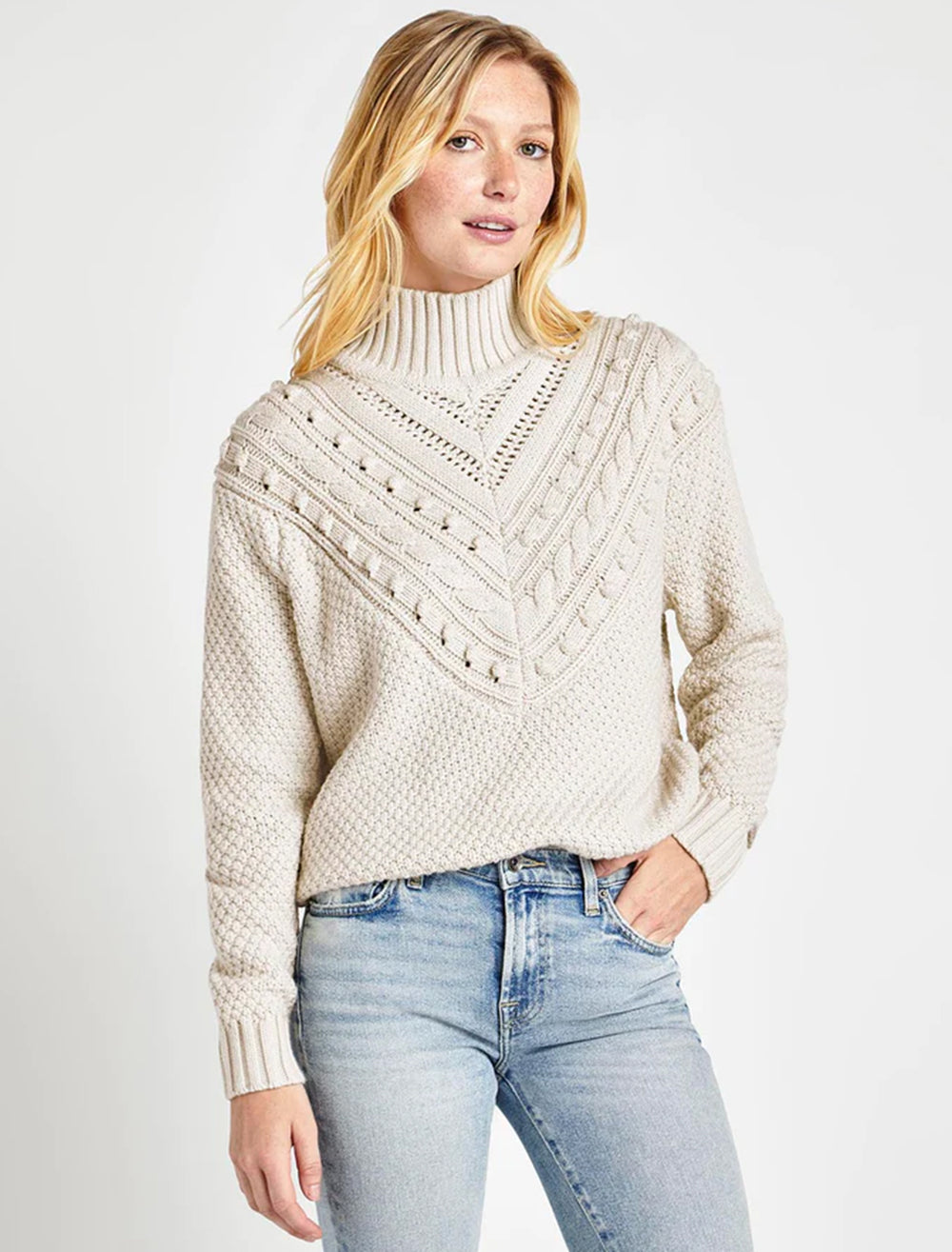Model wearing Splendid's maggie turtleneck sweater in white sand.