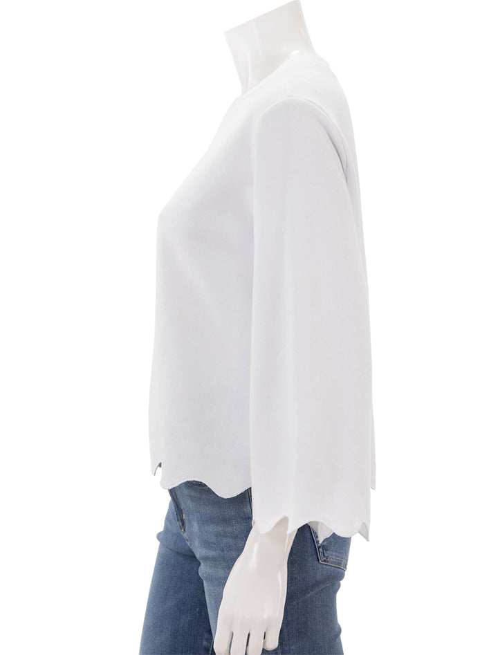Side view of Splendid's nori scallop trim sweatshirt in white.