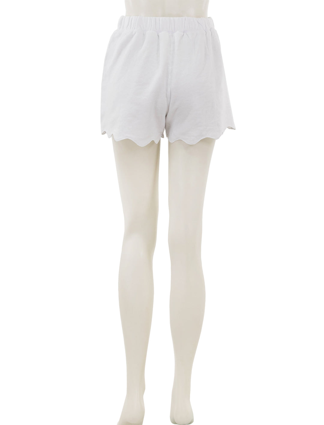 Back view of Splendid's nori scallop trim shorts in white.