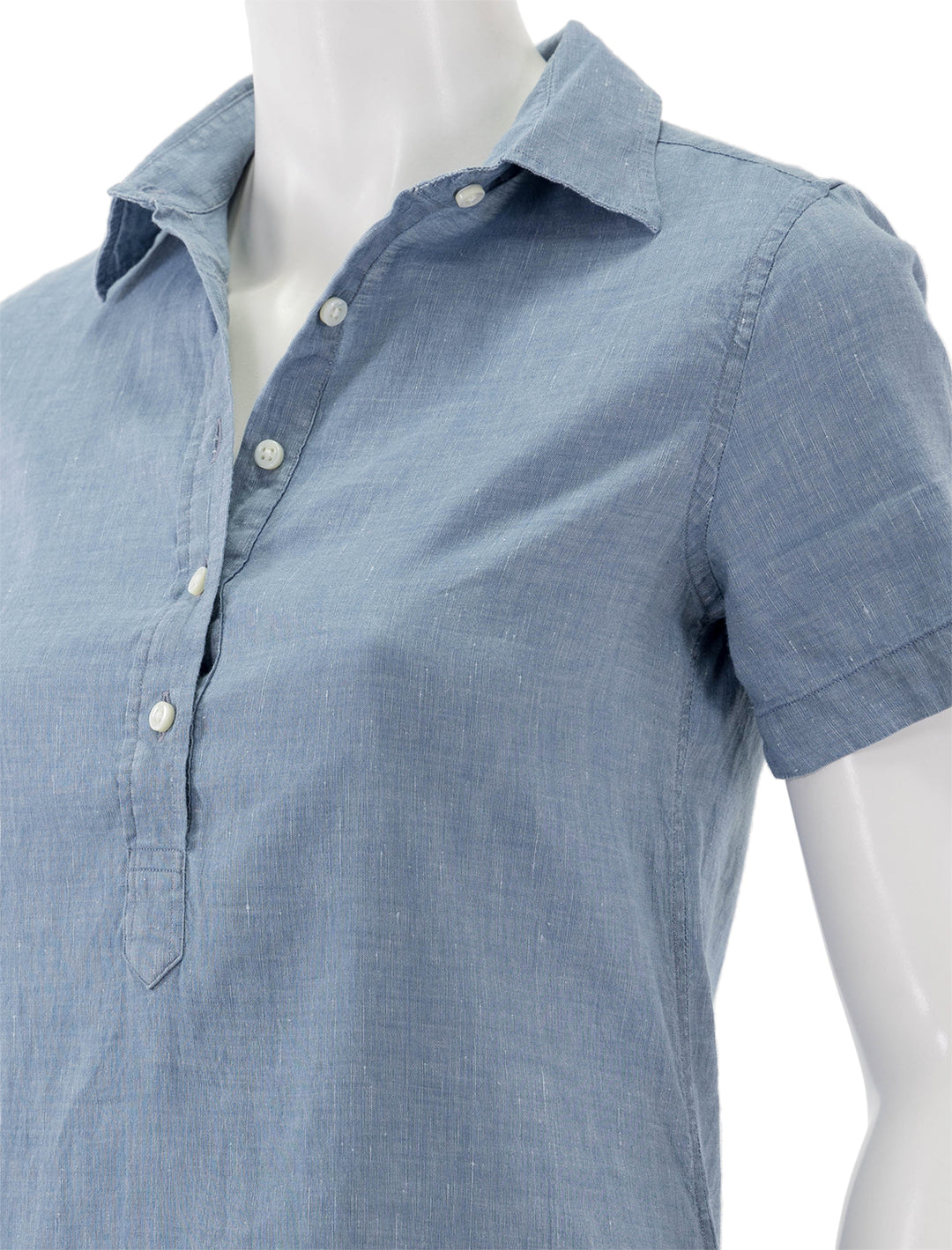 Close-up view of Ann Mashburn's short sleeved popover dress in light chambray.