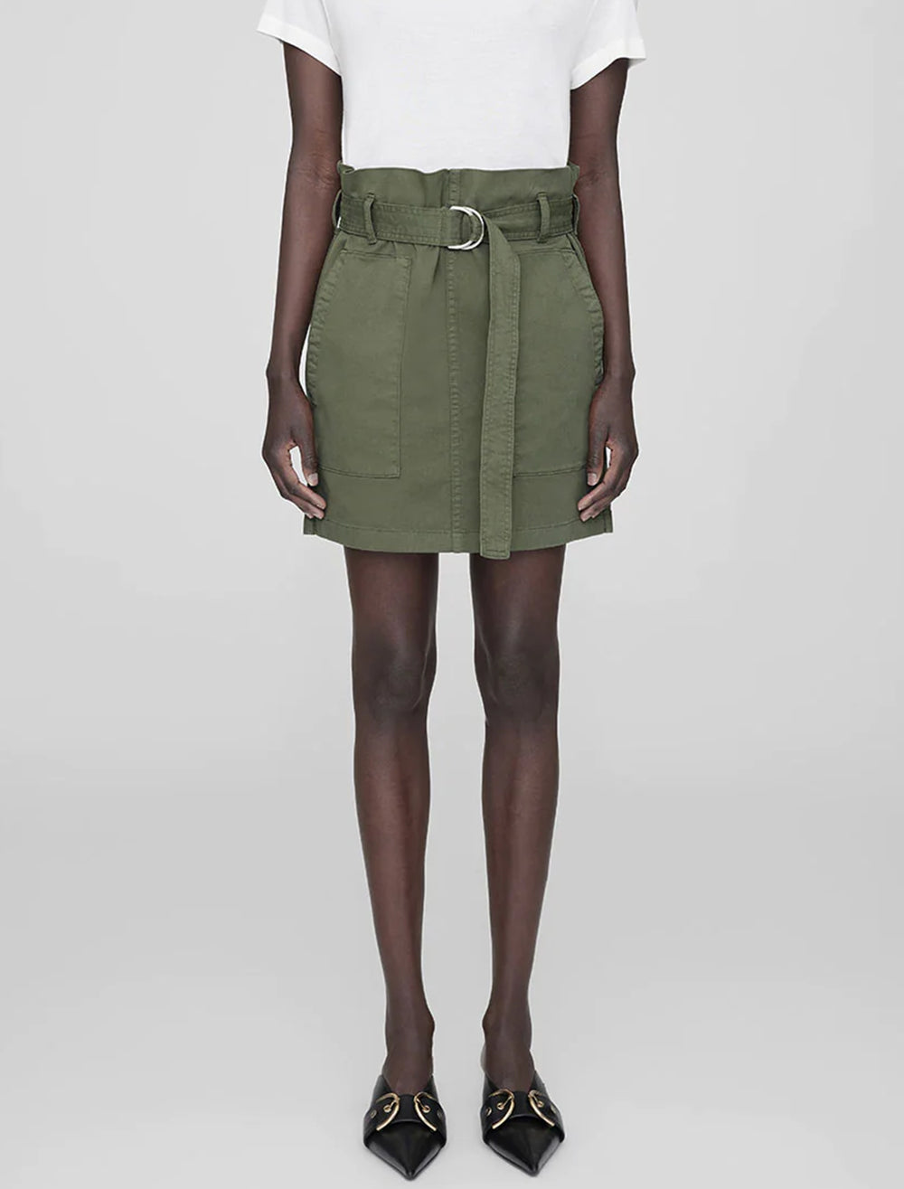 Model wearing Anine Bing's aveline skirt in army green.