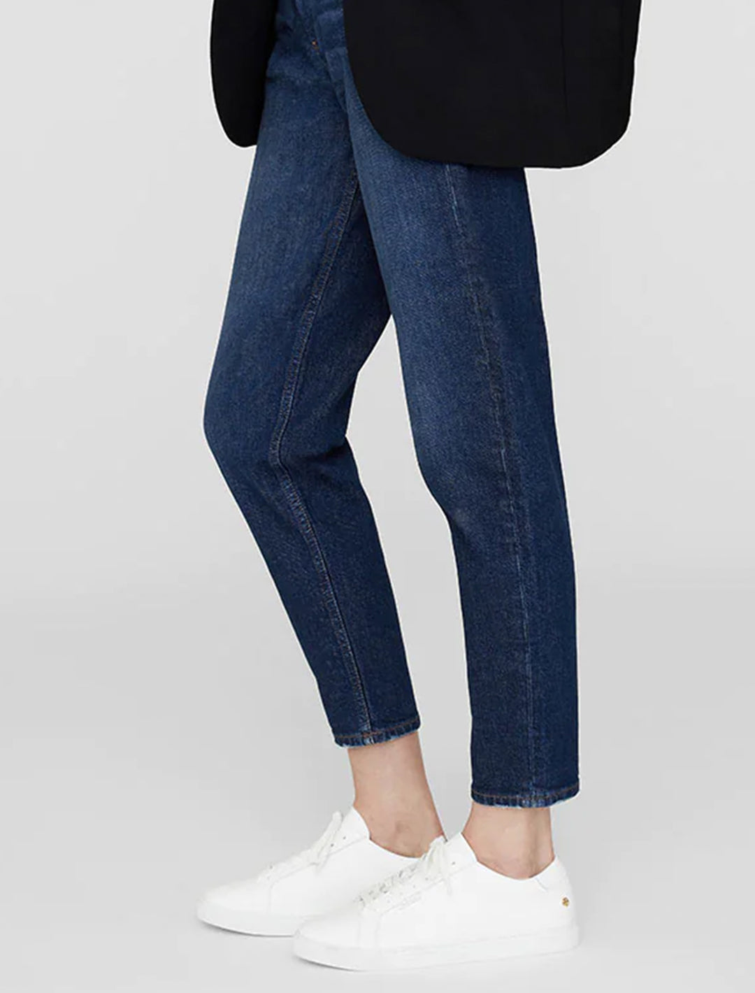 Model wearing Anine Bing's liane sneakers.