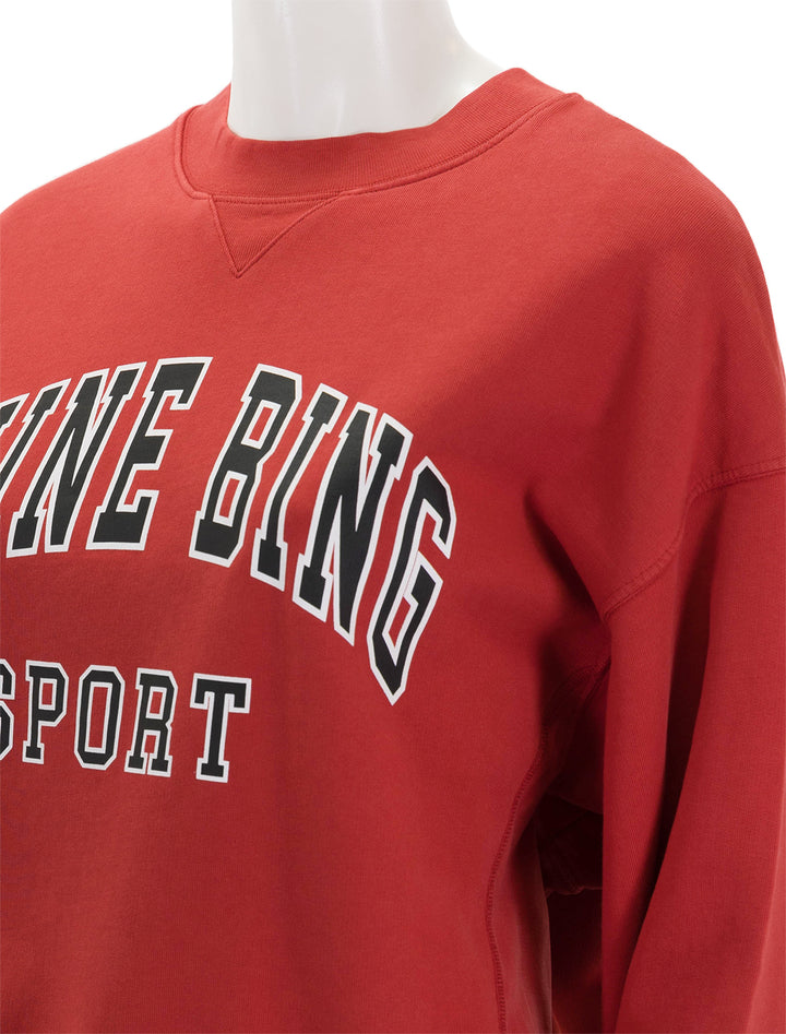 Close-up view of Anine Bing's jaci sweatshirt in red.