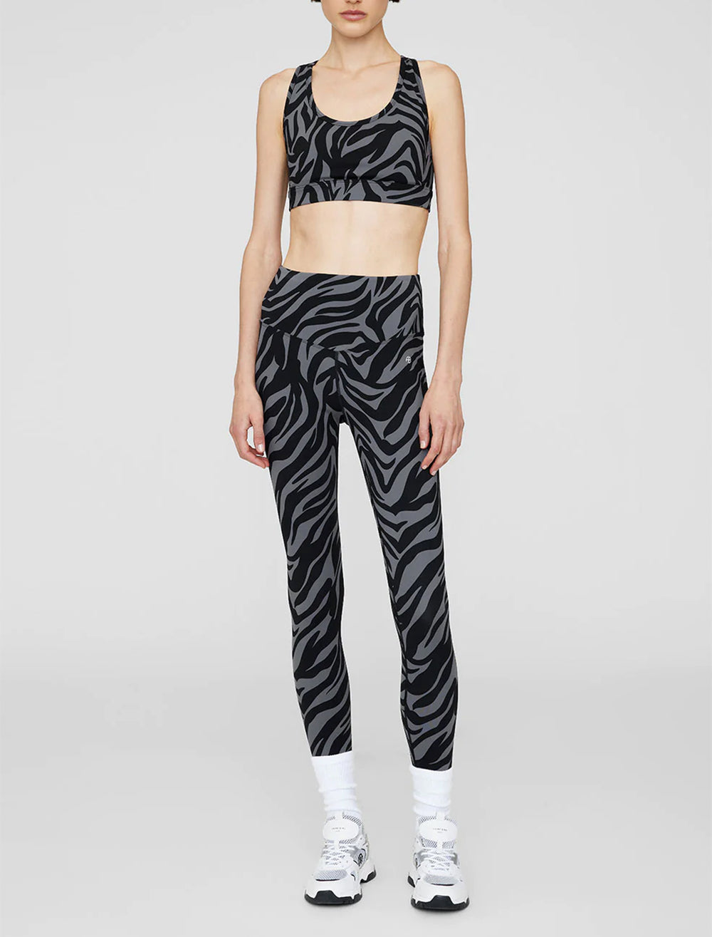 model wearing blake legging in zebra print with a matching sports bra
