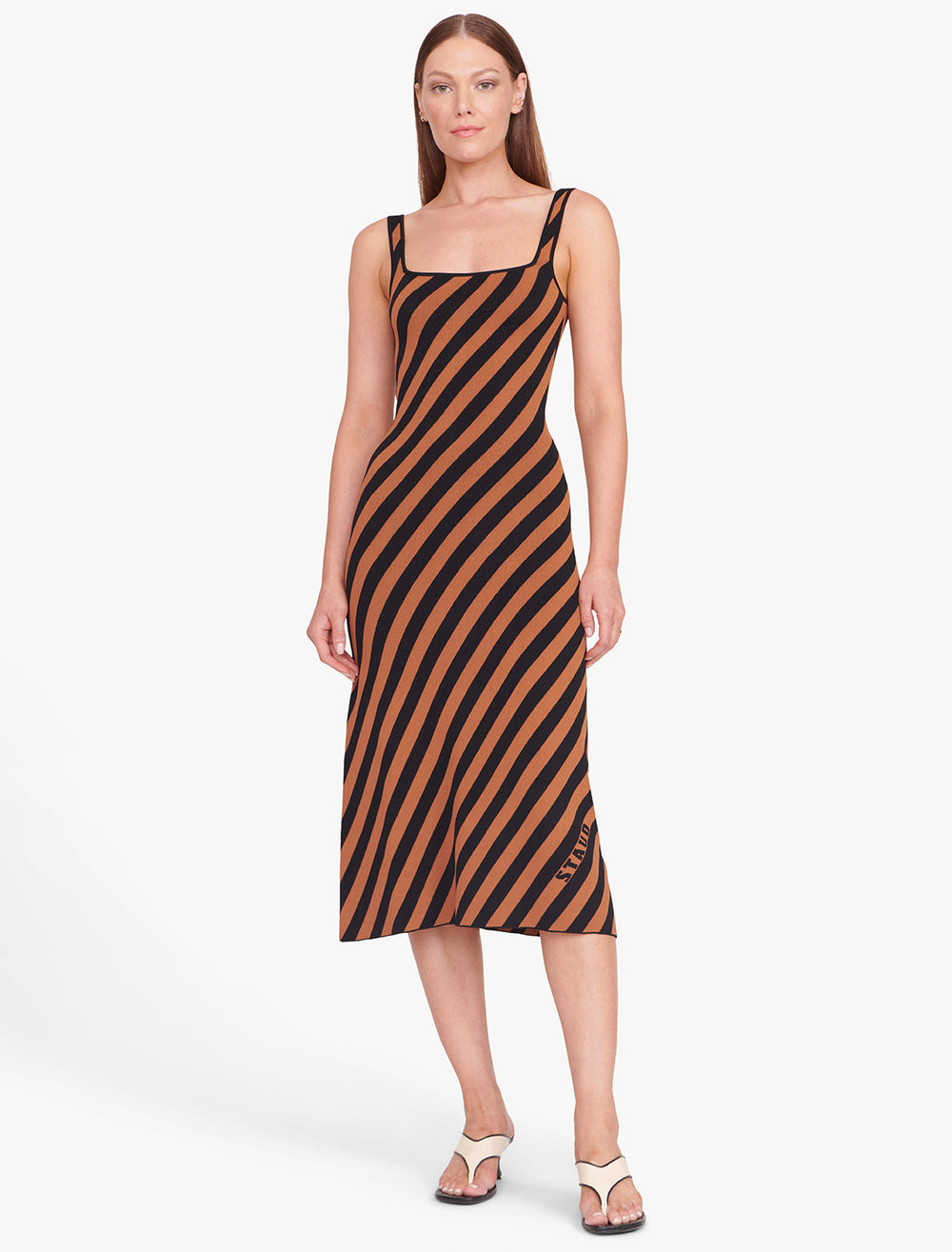 Model wearing STAUD's Kate Dress in Black and Tan Seashore Stripe.