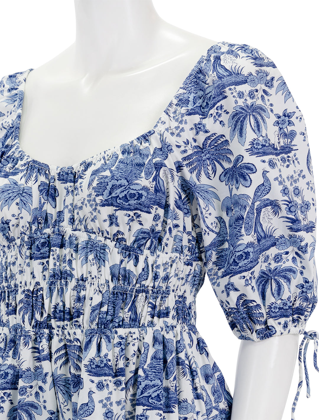 Close-up view of STAUD's mini faye dress in blue toile.