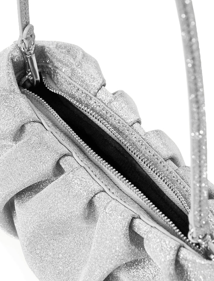 Close-up view of STAUD's bean convertible bag in diamond.