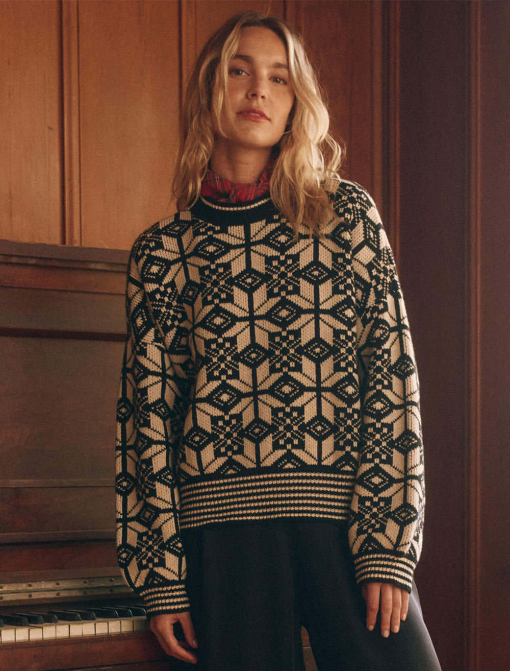 Model wearing The Great's the snowflake pullover in licorice.