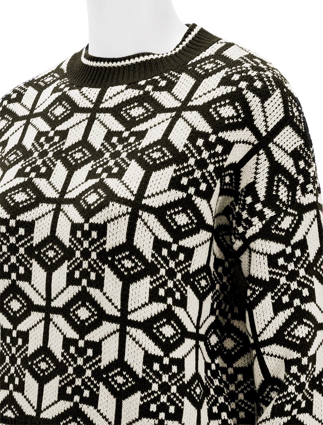 Close-up view of The Great's the snowflake pullover in licorice.