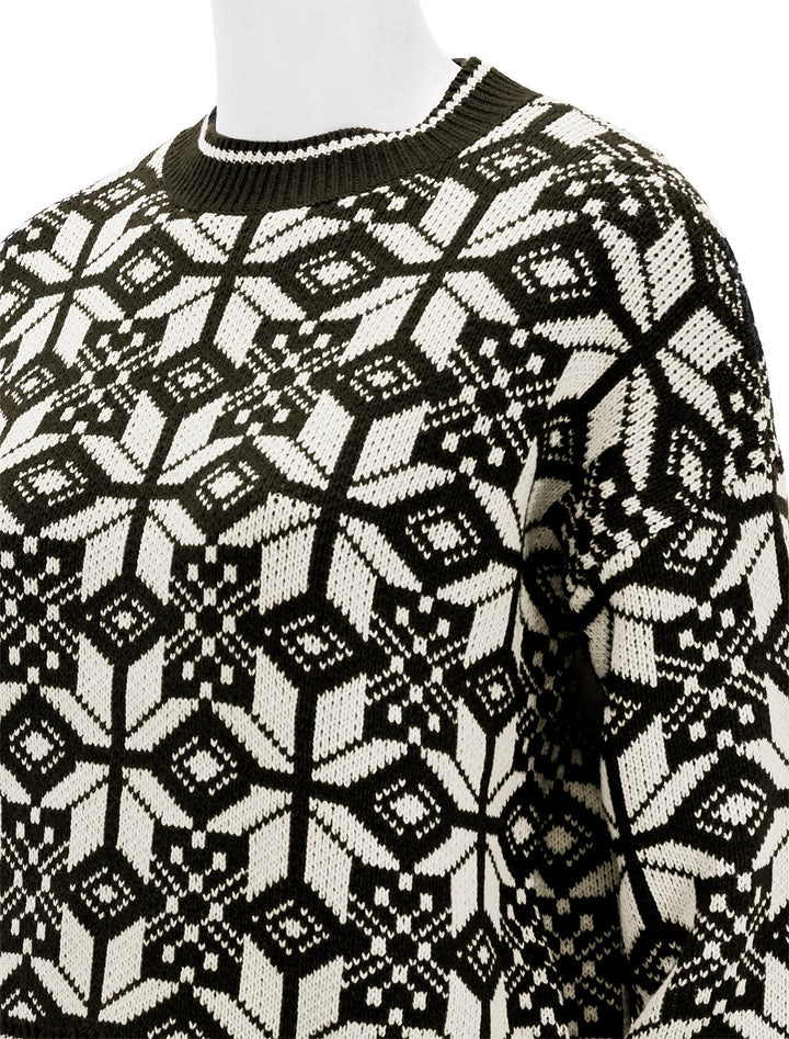 Close-up view of The Great's the snowflake pullover in licorice.