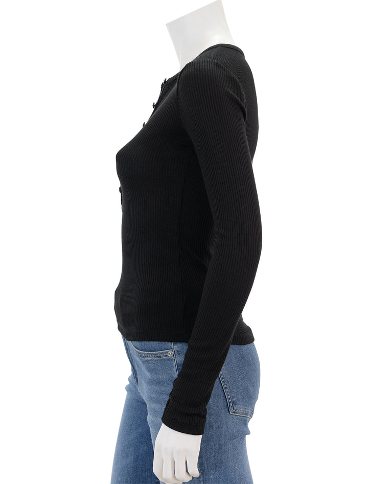 Side view of Rag & Bone's the knit rib henley in black.