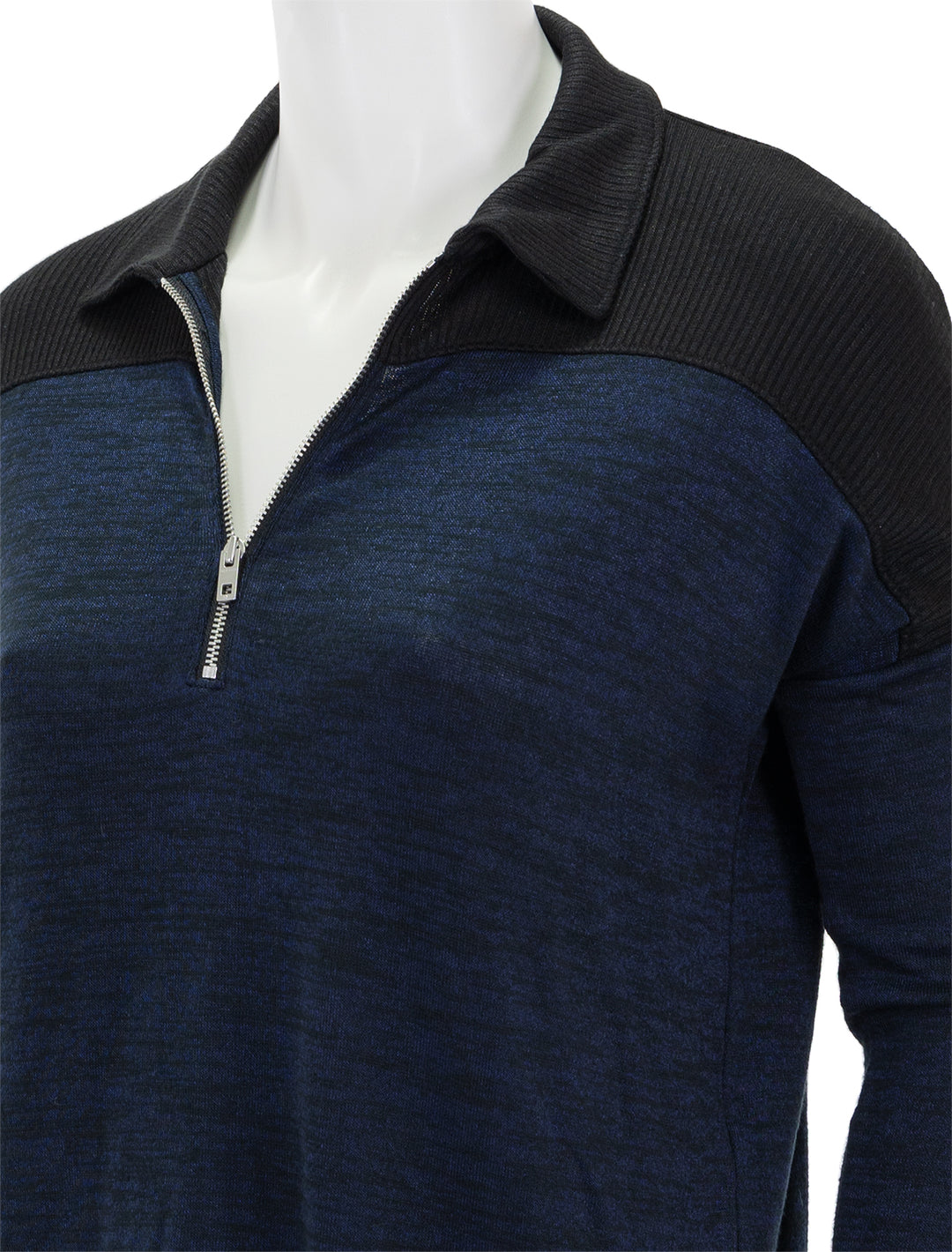 Close-up view of Rag & Bone's the knit zip polo in black.