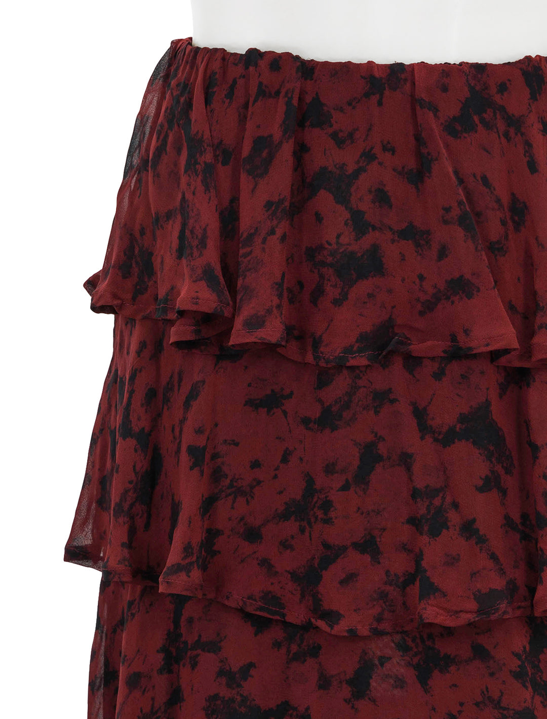 Close-up view of GANNI's tiered skirt in syrah.
