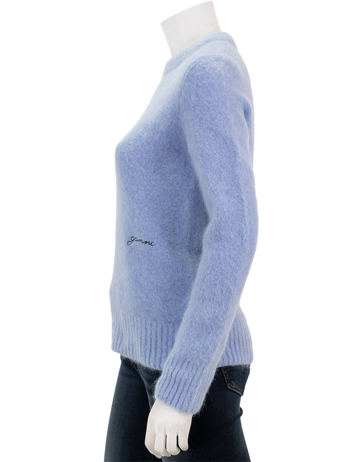 Side view of GANNI's brushed alpaca o-neck pullover in powder blue.