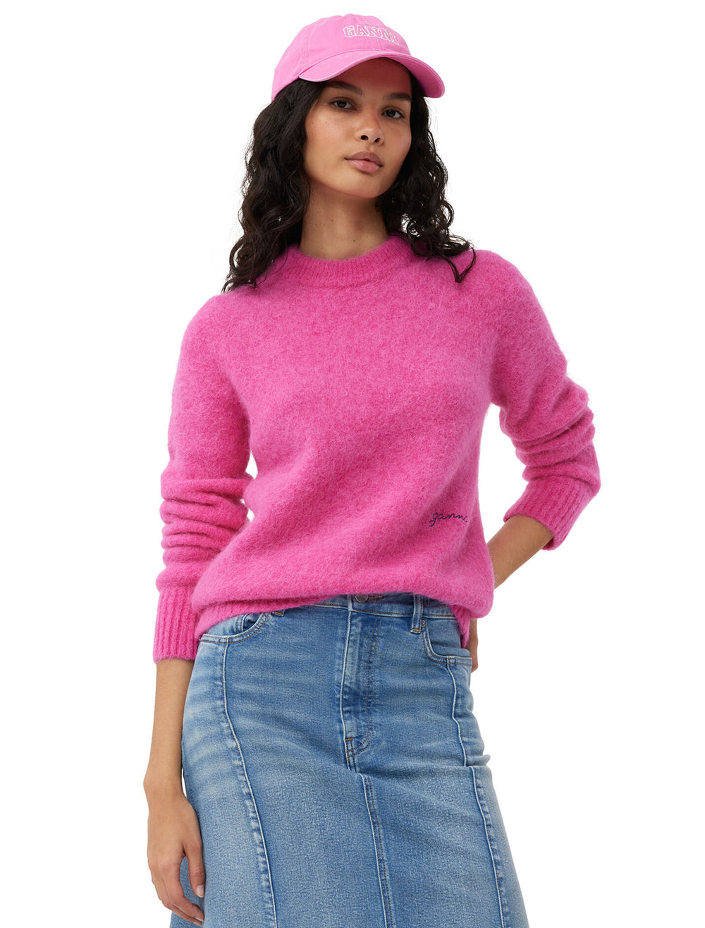 Model wearing GANNI's brushed alpaca o-neck pullover in cone flower.
