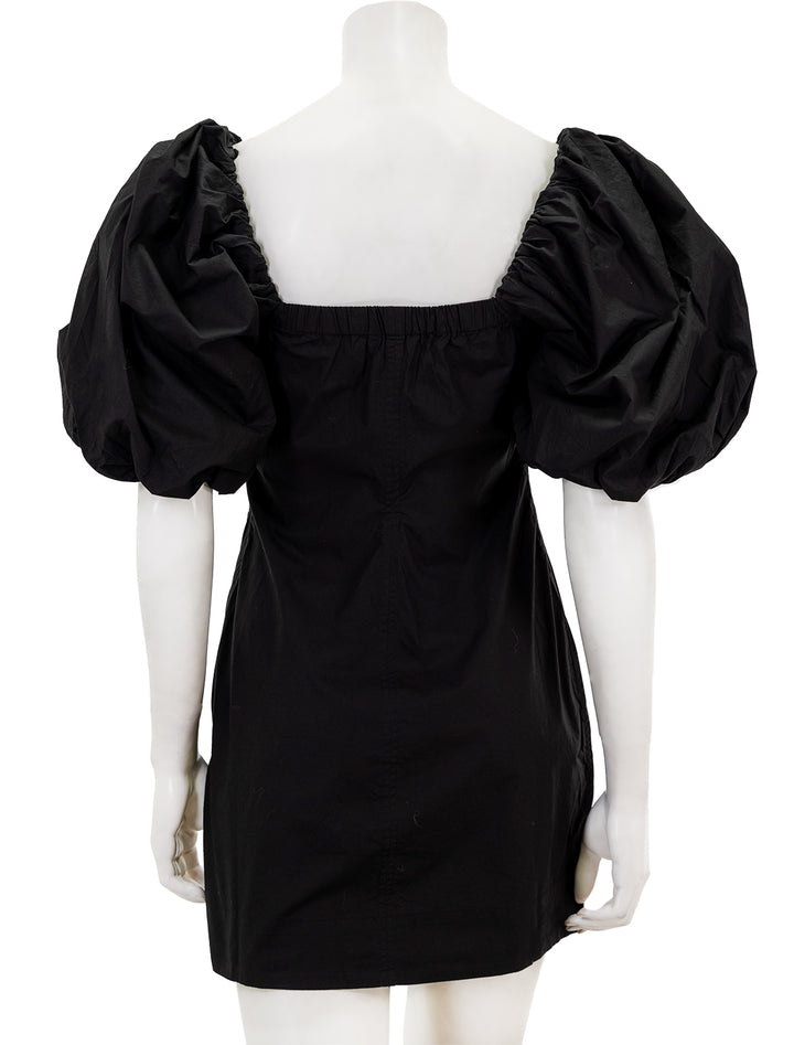 Back view of GANNI's cotton poplin twisted sleeve mini dress in black.