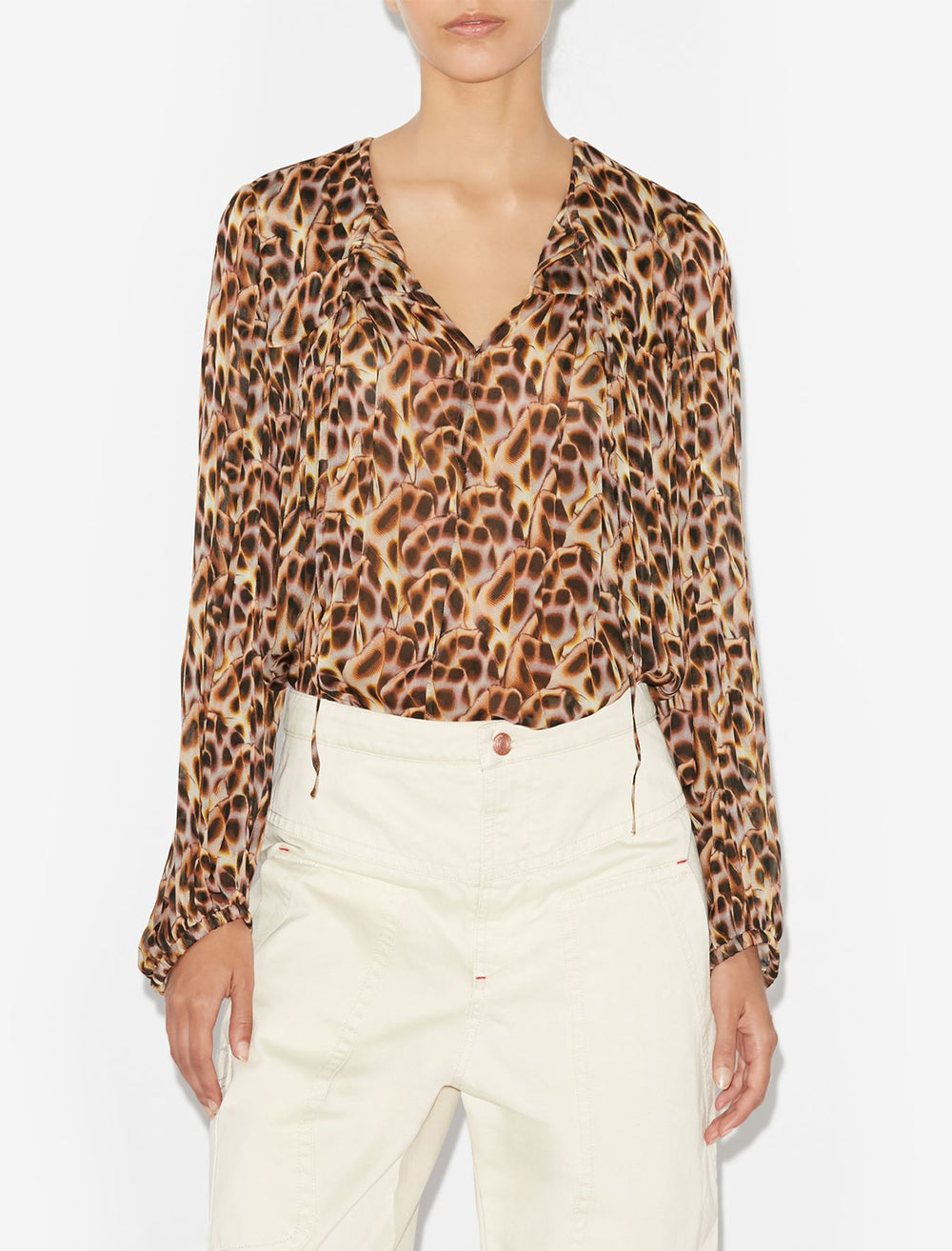 Model wearing Isabel Marant Etoile's daytonea blouse in ochre.