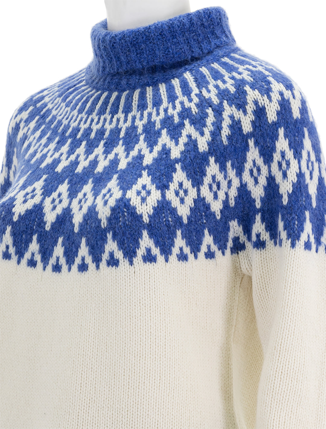 Close-up view of Alex Mill's bailey fair isle turtleneck in blue combo.