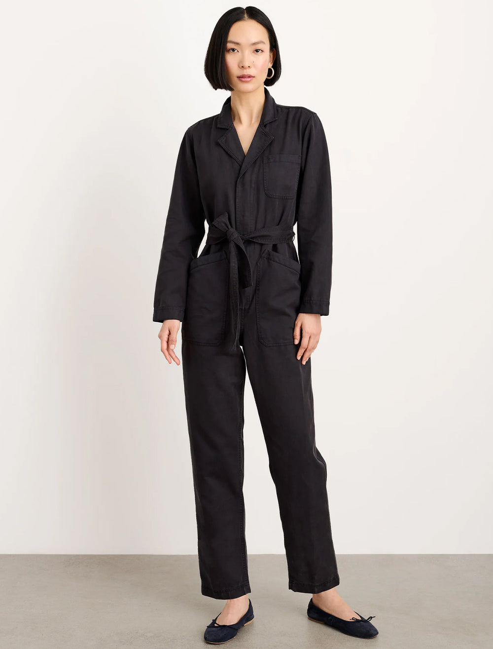 Model wearing Alex Mill's standard zip jumpsuit in black.
