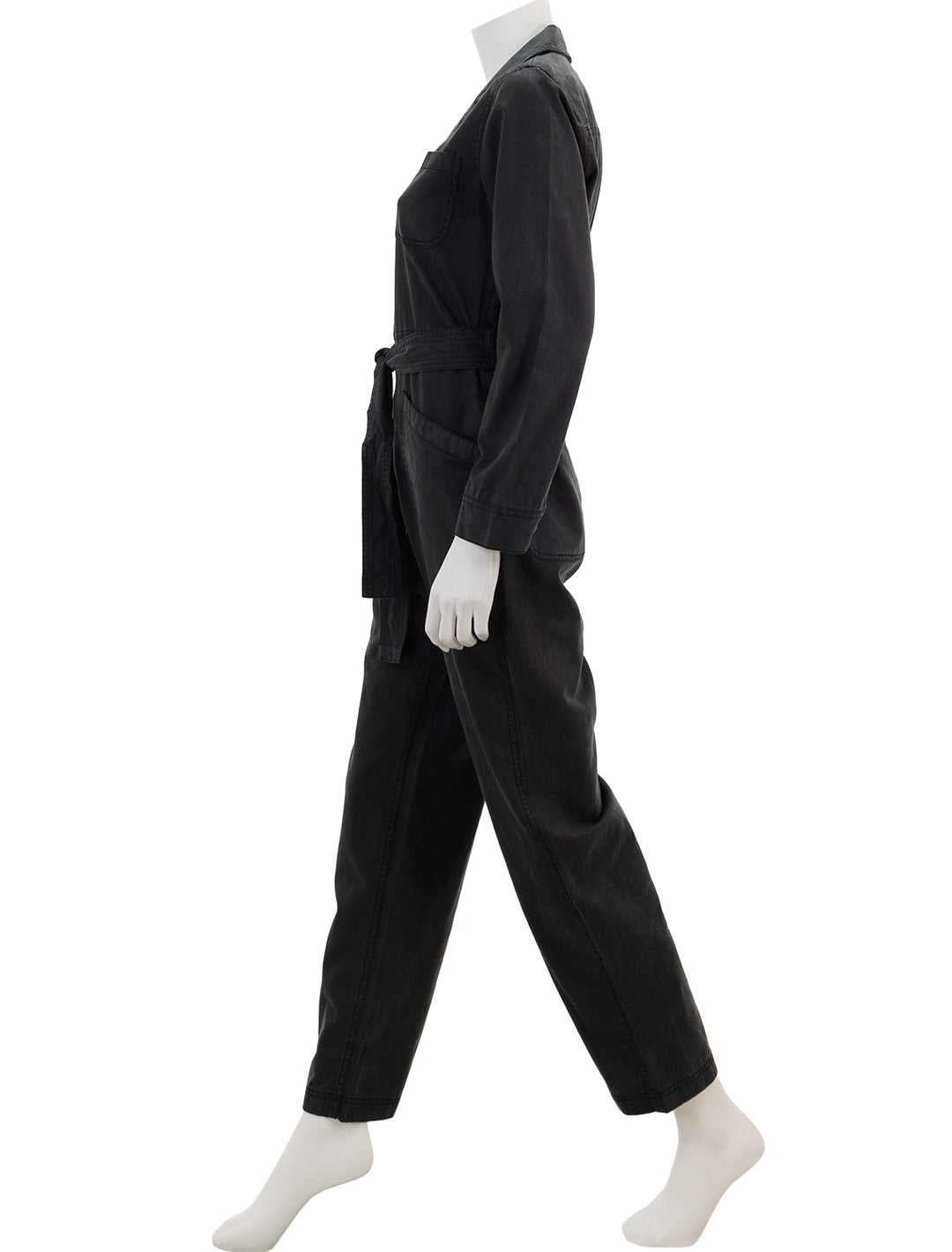 Side view of Alex Mill's standard zip jumpsuit in black.
