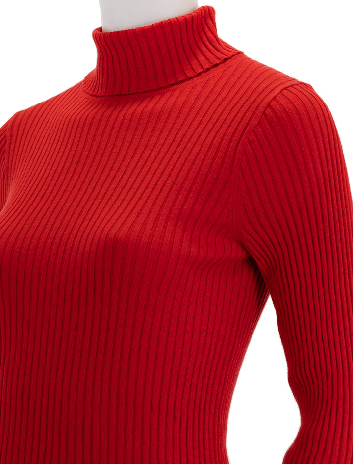 Close-up view of Alex Mill's cristy ribbed turtleneck in red.