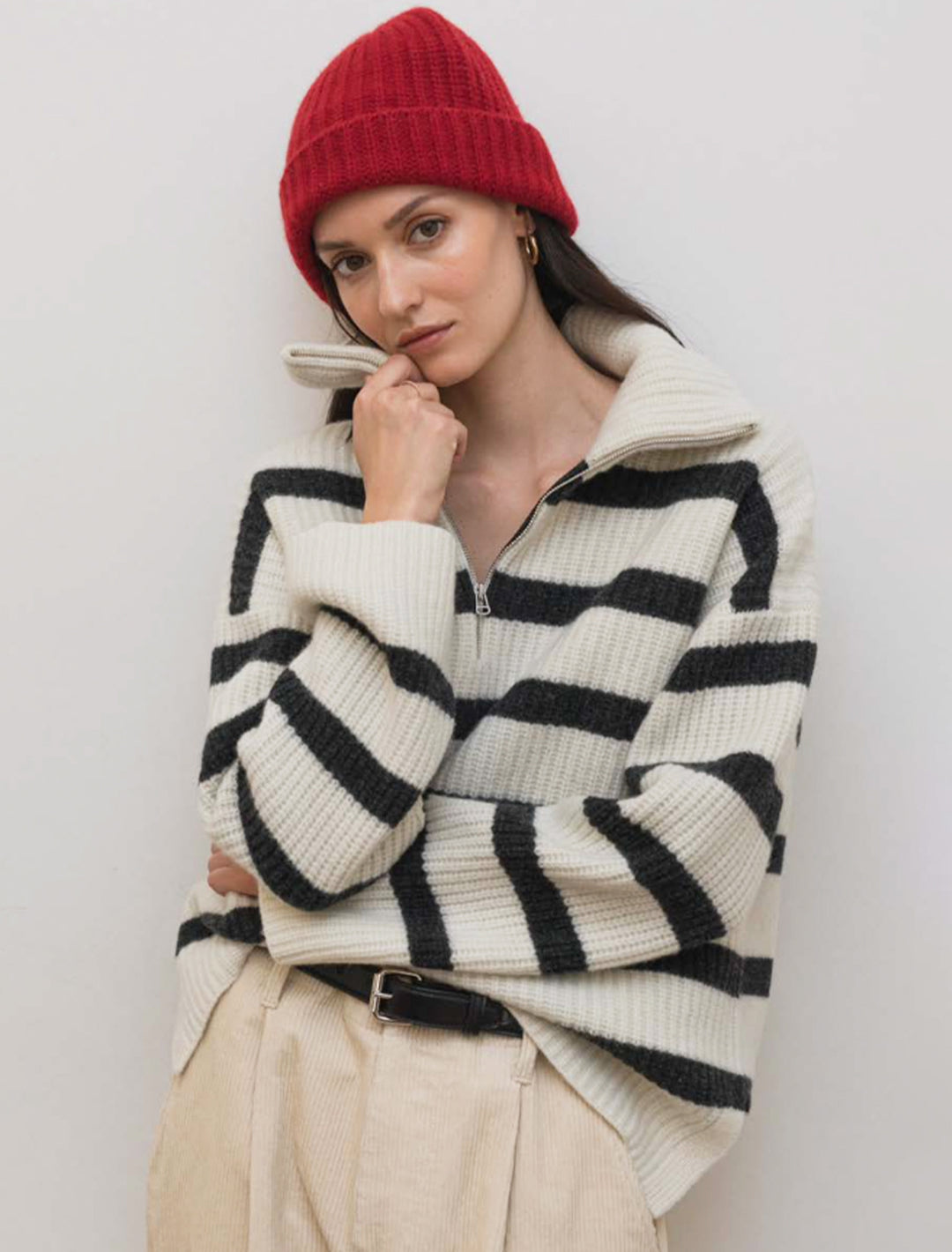 Model wearing Alex Mill's felix zip merino pullover in ivory and charcoal stripe.
