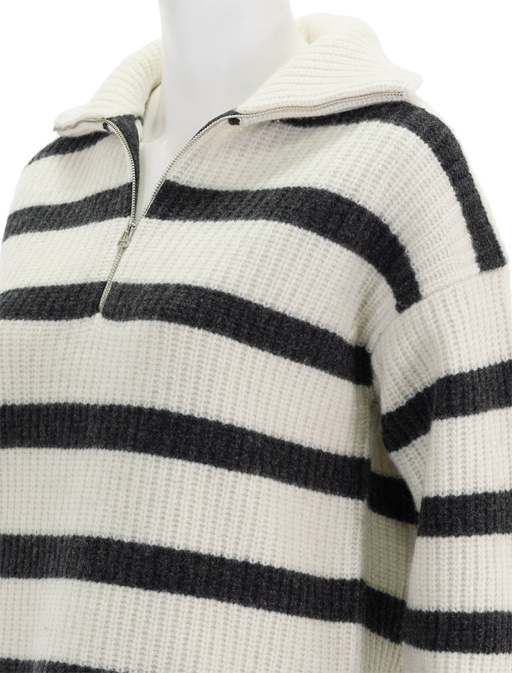 Close-up view of Alex Mill's felix zip merino pullover in ivory and charcoal stripe.