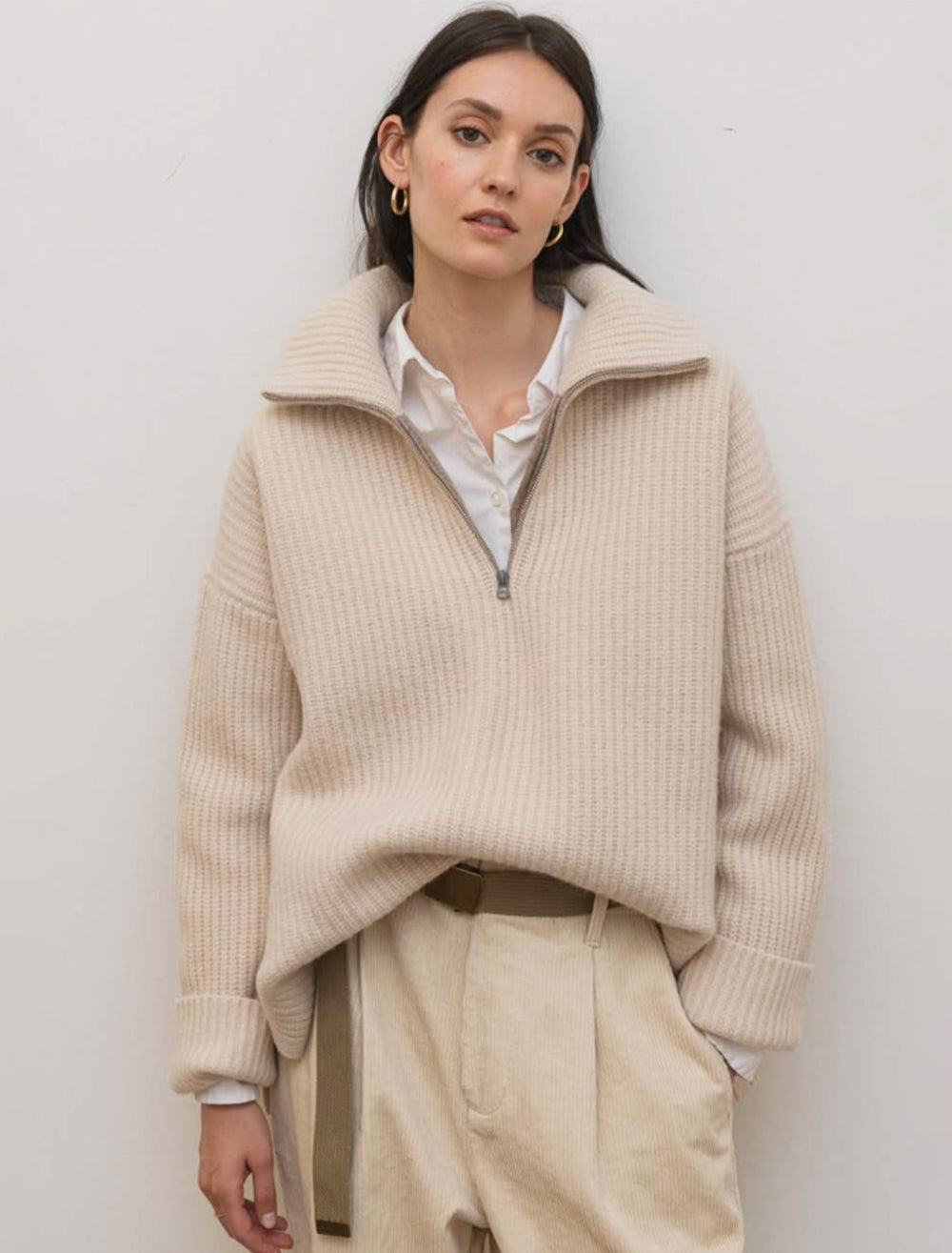 Model wearing Alex Mill's felix zip merino pullover in buttermilk.