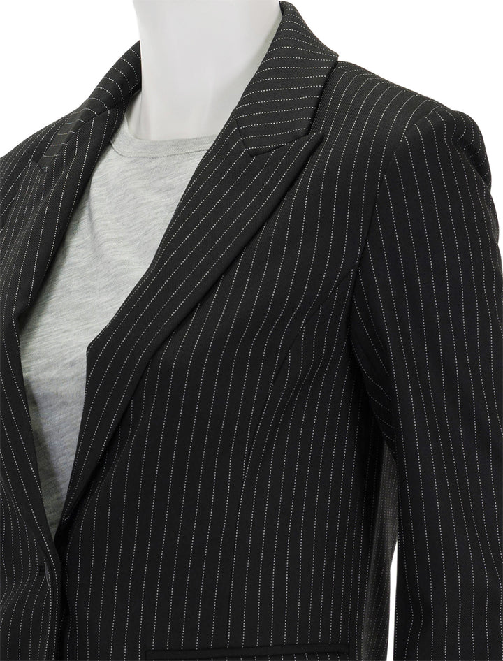 Close-up view of Saint Art's jackie blazer in charcoal pinstripe.