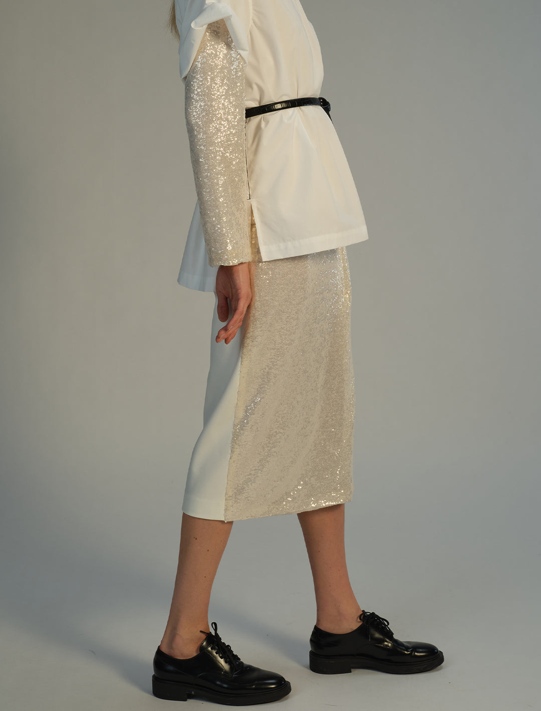 Model wearing Saint Art's Celine Midi Wrap Skirt in Ivory Sequin.