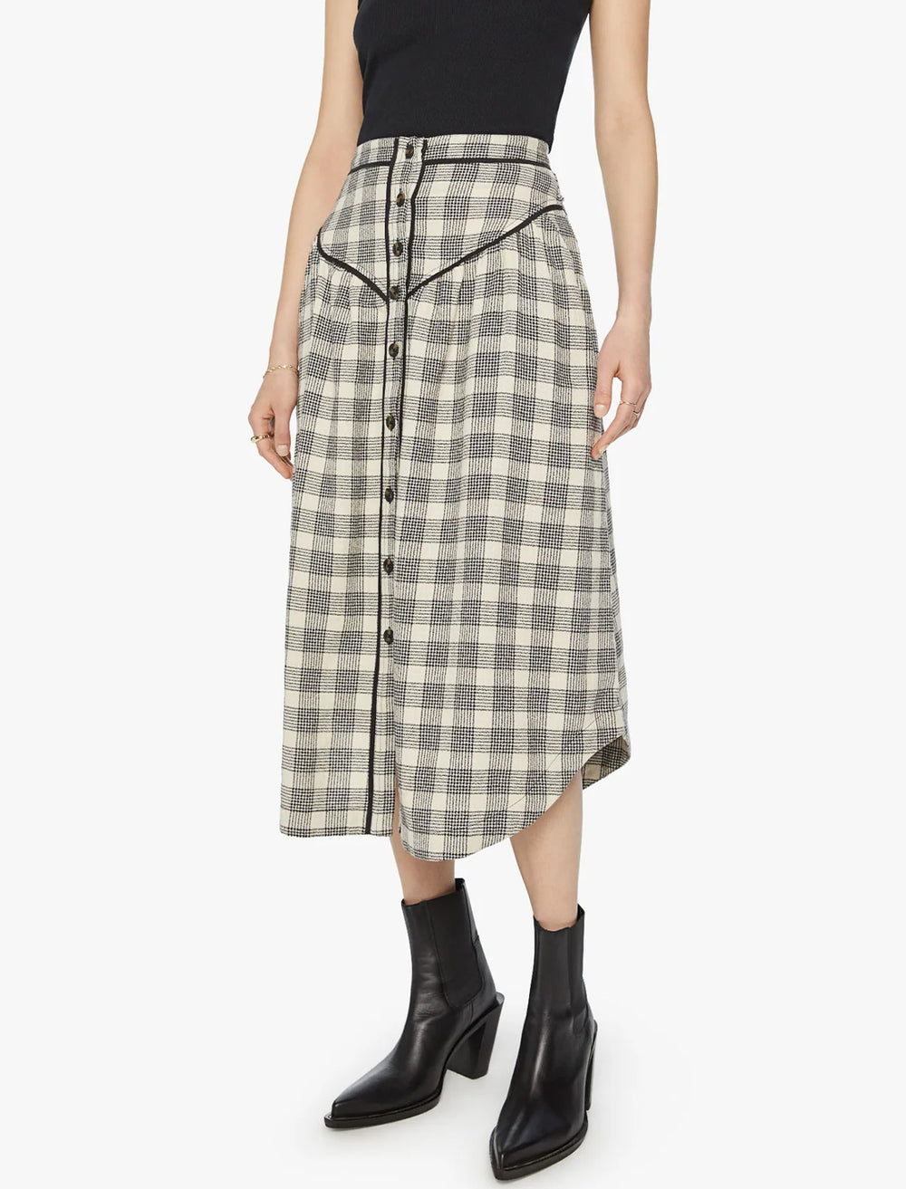 Model wearing Mother Denim's the out skirts in black and cream plaid.