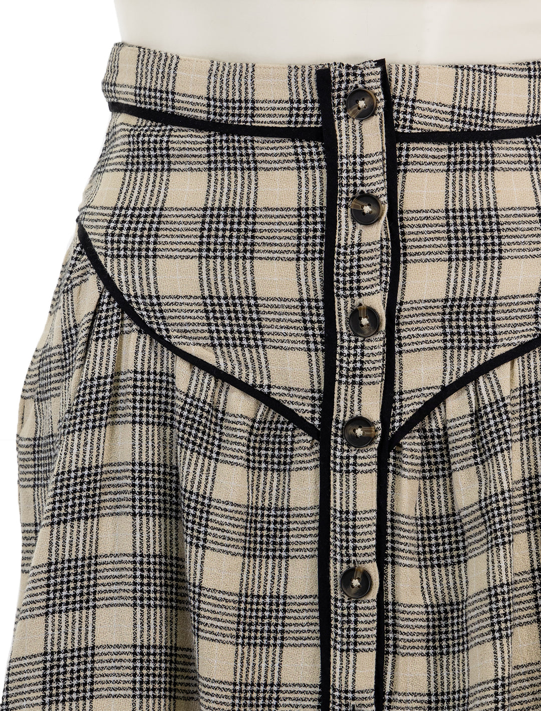 Close-up view of Mother Denim's the out skirts in black and cream plaid.