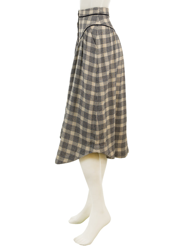 Side view of Mother Denim's the out skirts in black and cream plaid.